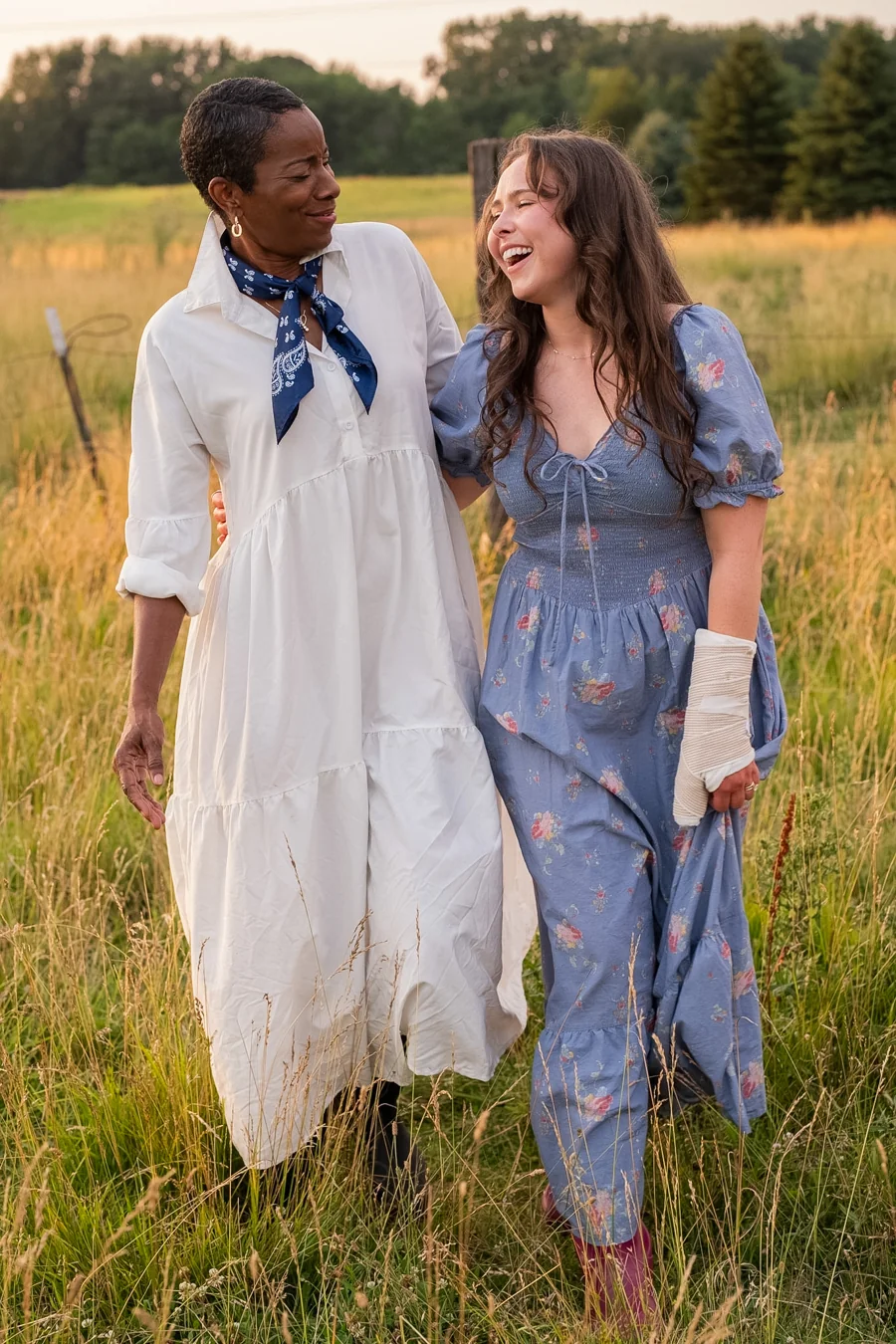 Two women laughing together in the 2027 photoshoot